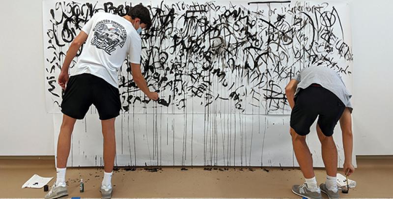 Students of Lori Esposito's course “Visual Culture: Investigating Diversity and Social Justice” creating artwork for the exhibition, "Rapid Fire Text."