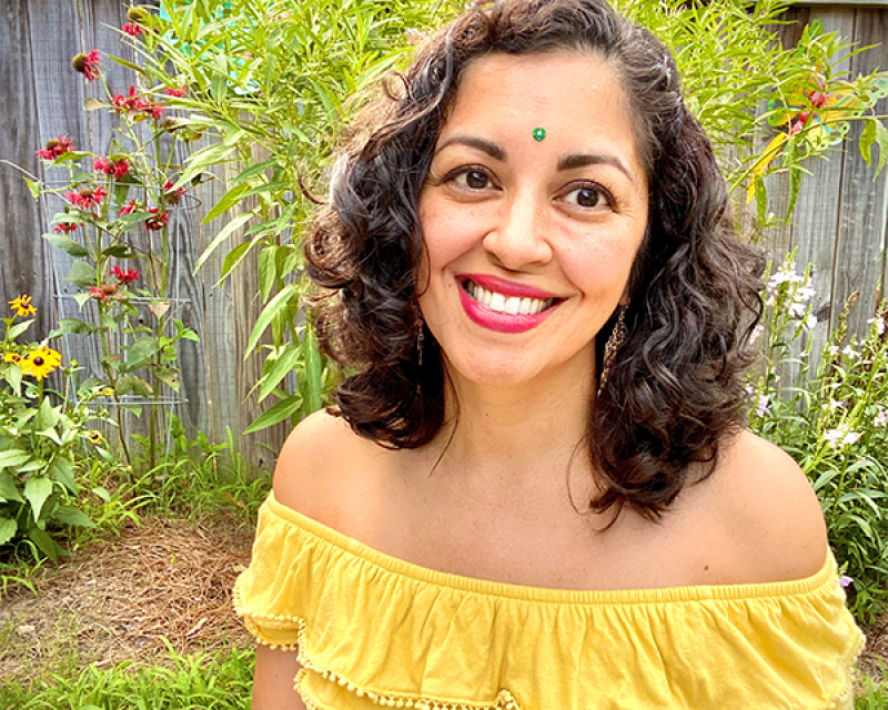 Aimee Nezhukumatathil outside in garden