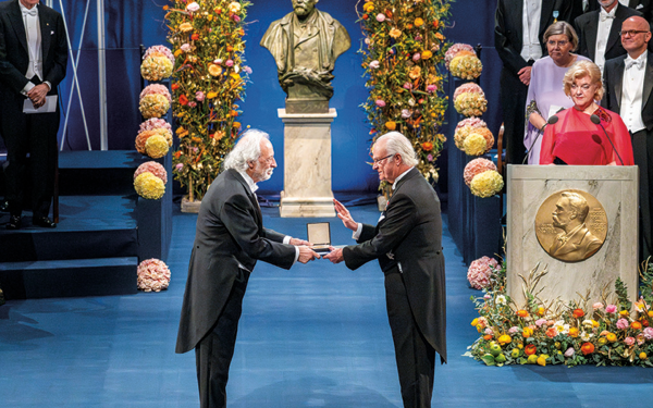 Pierre Agostini (left) is presented with the 2023 Nobel Prize in Physics by King Carl XVI Gustaf of Sweden during the Nobel awards ceremony at the Concert Hall in Stockholm, Sweden on December 10, 2023.